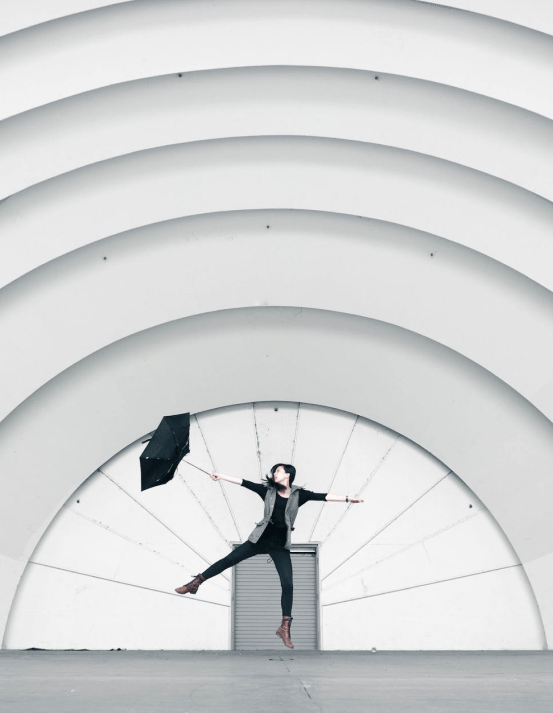 Happy person with an umbrella